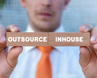 When should a startup outsource bookkeeping vs do it in-house