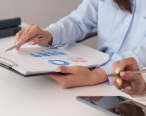How does outsourced bookkeeping help with cash flow management and real-time financial insights?